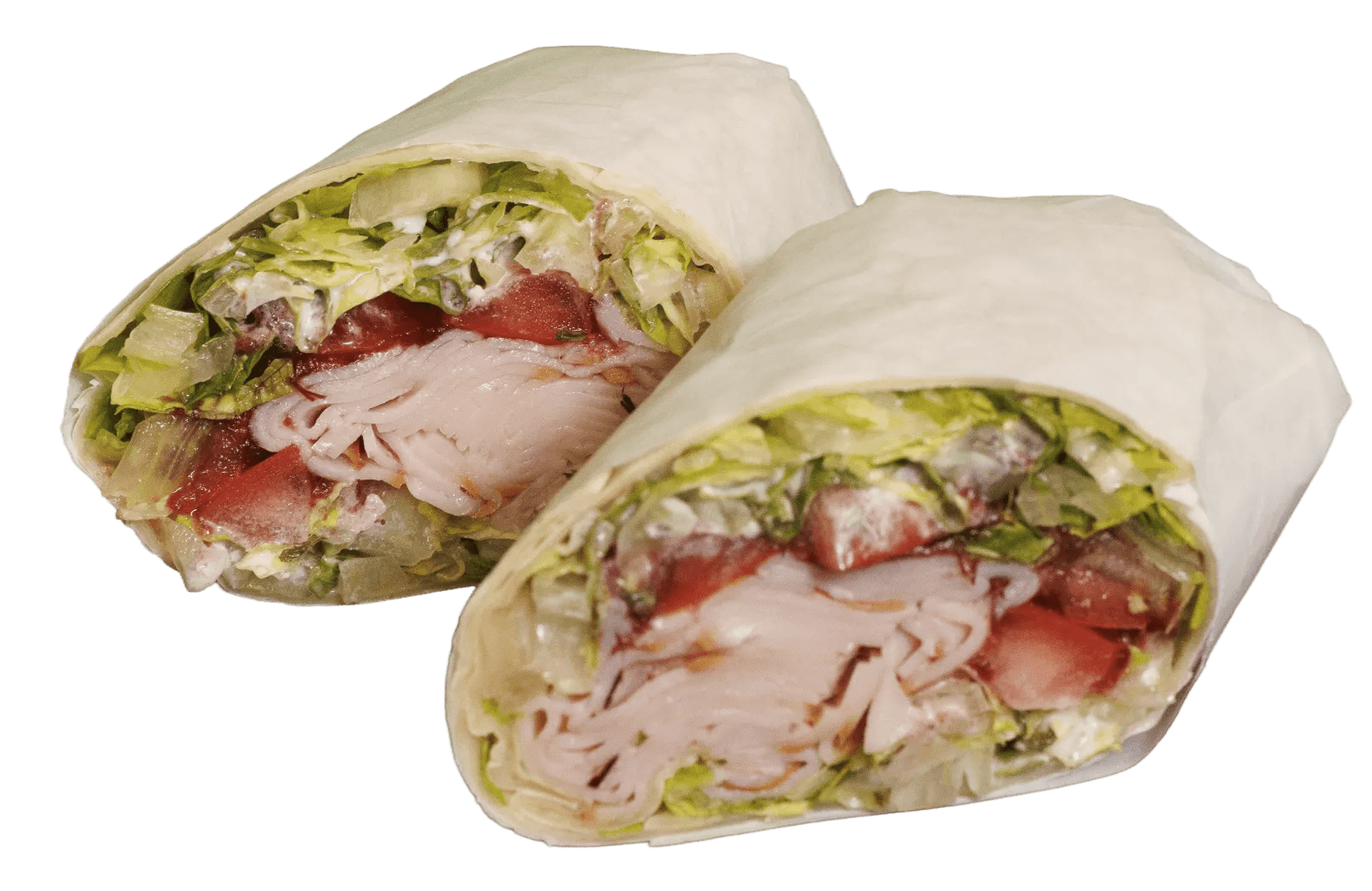 Two turkey breast wraps, cut in half, reveal sliced turkey, crisp lettuce, red tomatoes, and creamy dressing inside a flour tortilla.